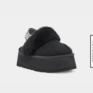 Black platform UGG slippers.